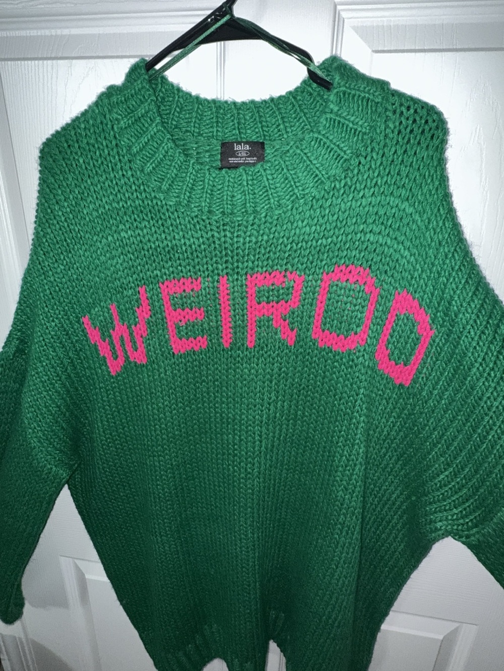 Dressed in LALA green "WEIRDO" Knit Sweater with Pink Lettering